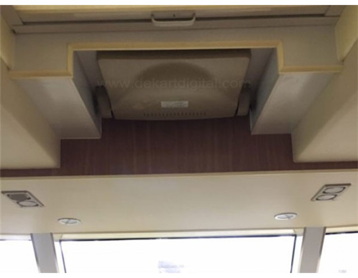 Motorized flip-down ceiling monitors for yachts and boats